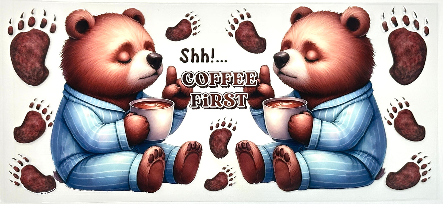 Two cartoon bears in pajamas holding coffee cups with text 'Shh! Coffee First' 