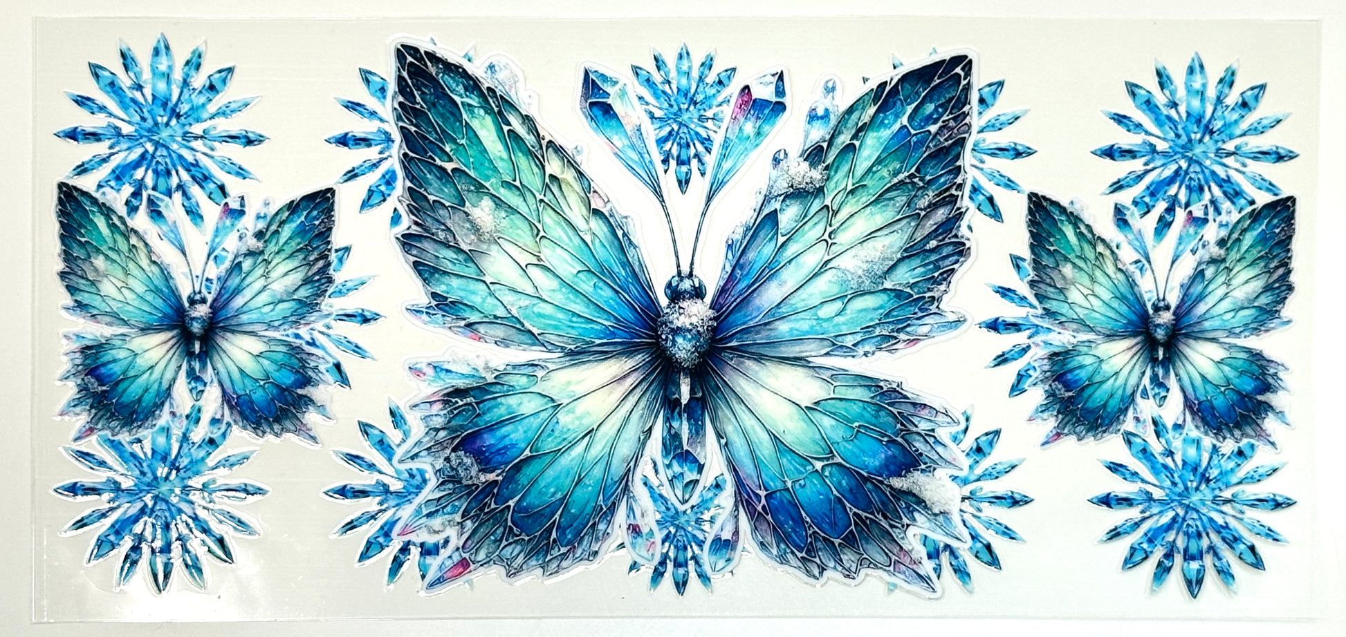 Three blue butterflies surrounded by snowflakes 