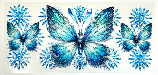 Three blue butterflies surrounded by snowflakes 