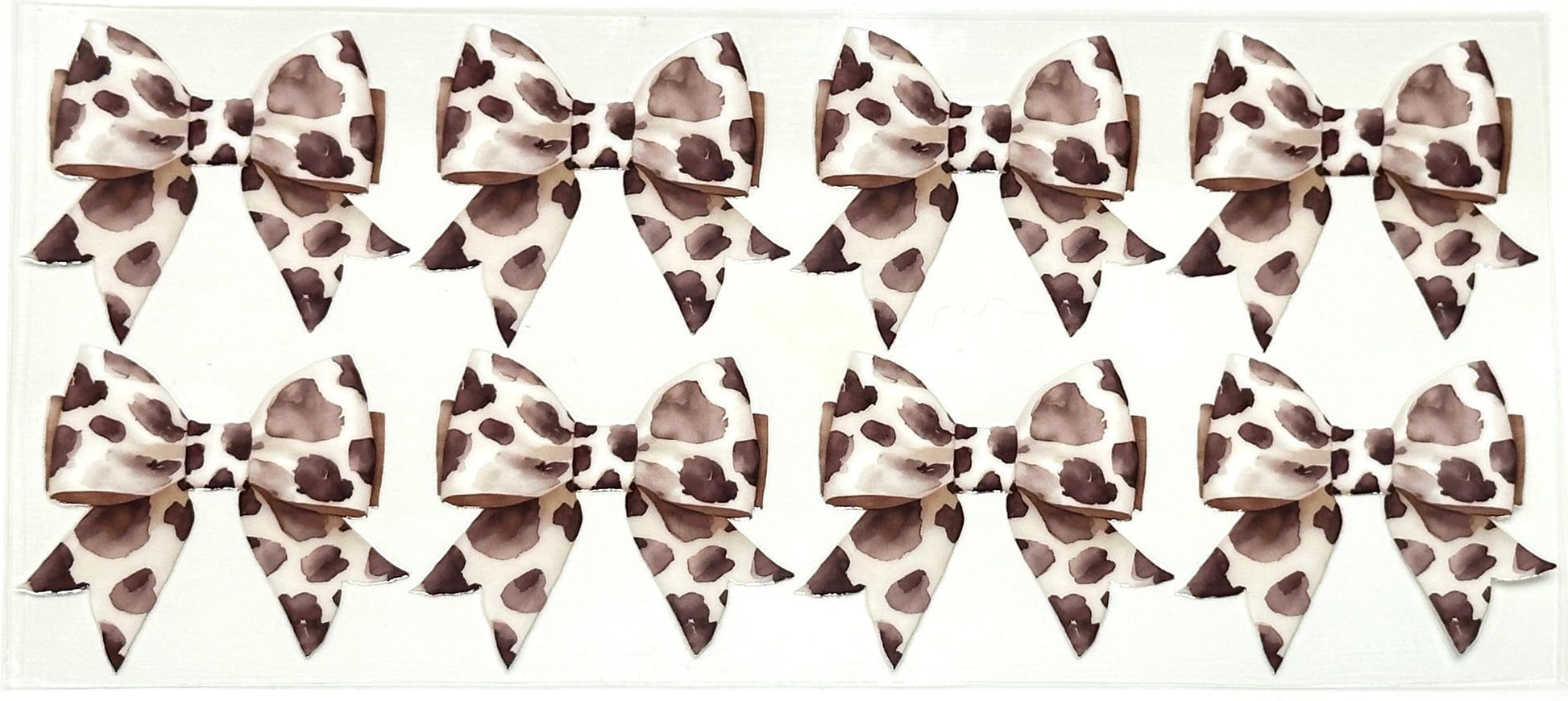 Multiple leopard print hair bows arranged in a grid