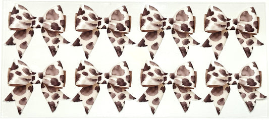 Multiple leopard print hair bows arranged in a grid