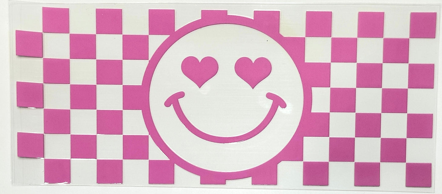 Checkered pattern with a smiley face design featuring hearts on a pink and white background.