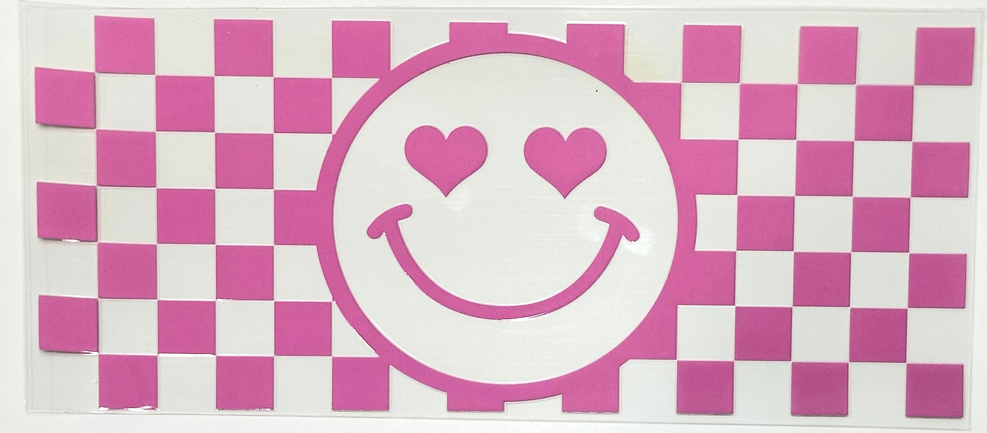 Checkered pattern with a smiley face design featuring hearts on a pink and white background.