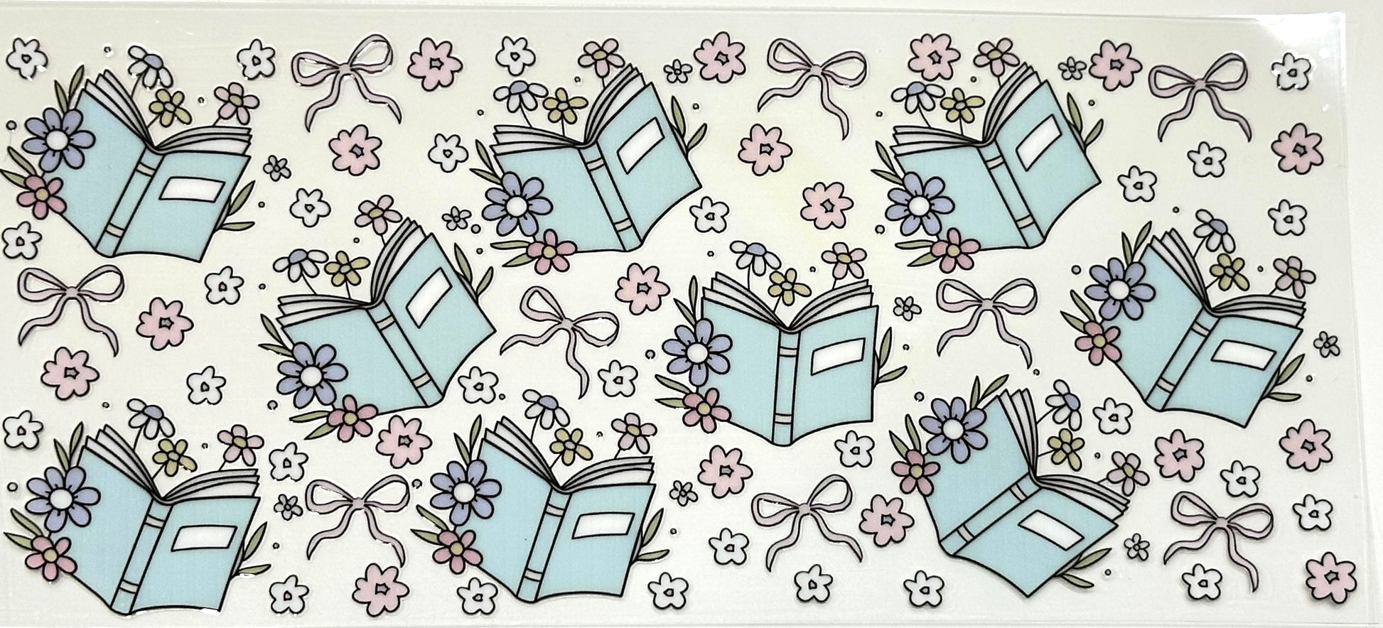 Pattern of books, flowers, and ribbons on a light background