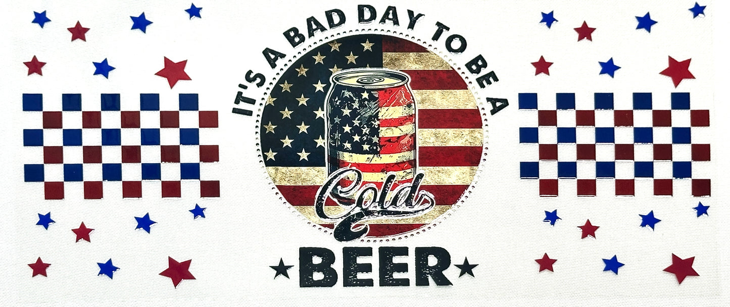 American flag-themed graphic with text 'It's a bad day to be a cold beer' surrounded by stars and checkered patterns.