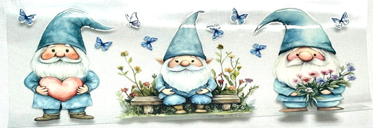 Three cartoon gnomes with blue hats and suits, holding a heart, flowers, and a basket of flowers, surrounded by butterflies 