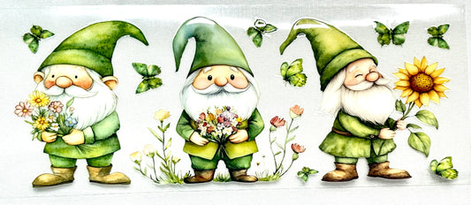 Three cartoon gnomes with green hats and outfits, holding flowers and sunflowers 