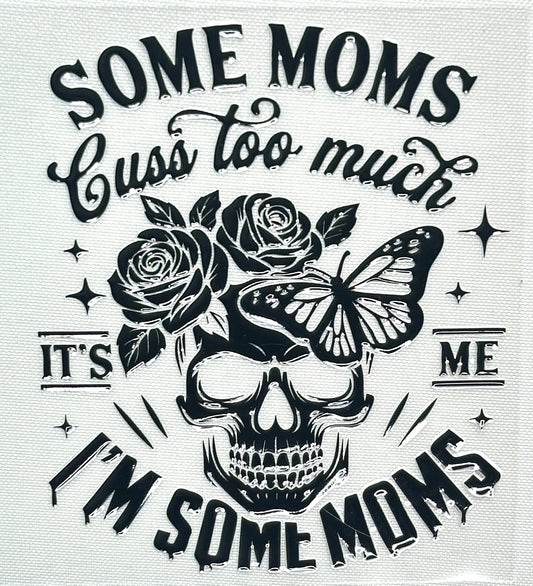 Skull design with roses and a butterfly, surrounded by text 