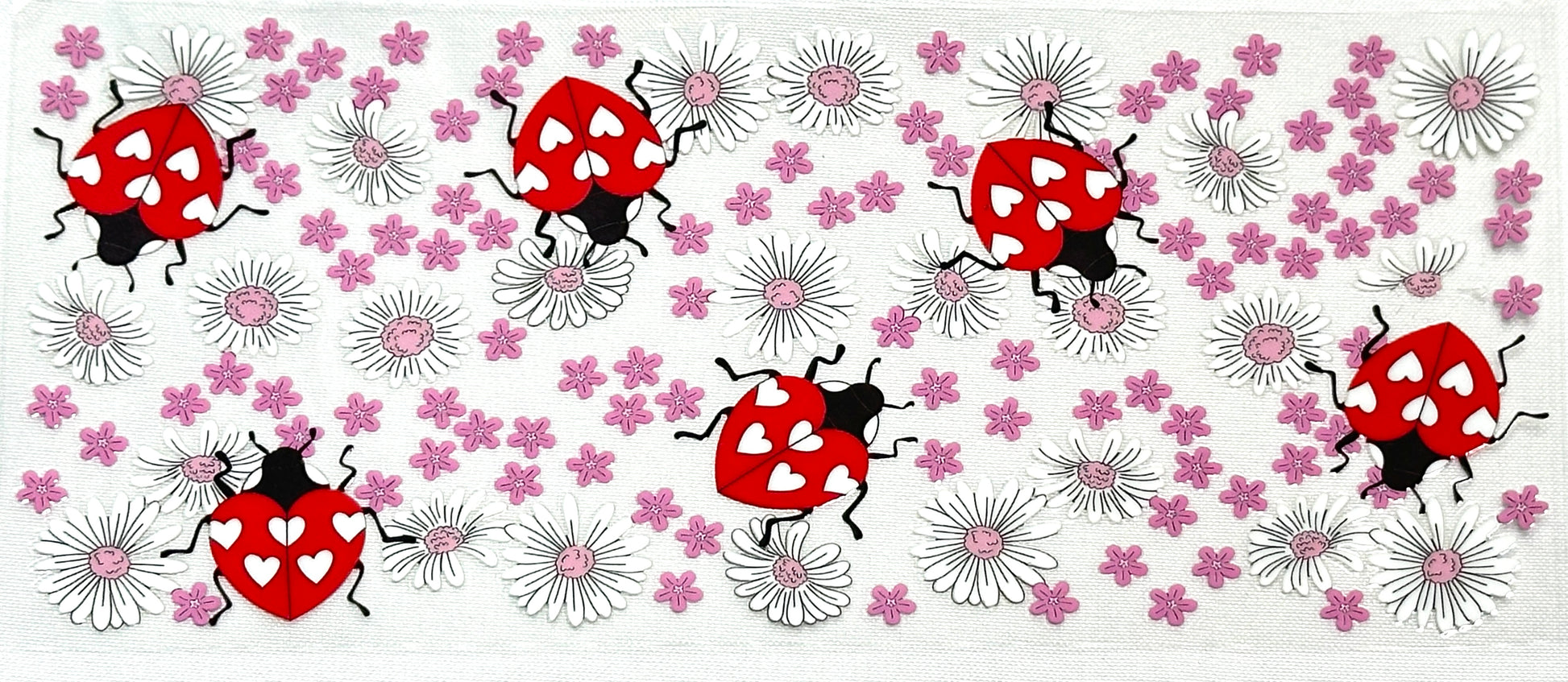 Pattern of red ladybugs and pink flowers 