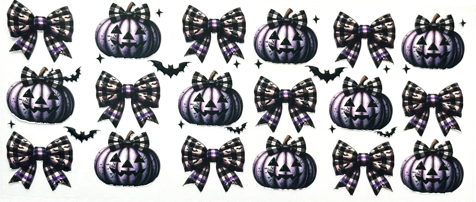 Halloween-themed decorative elements including pumpkins, bows, and bats 
