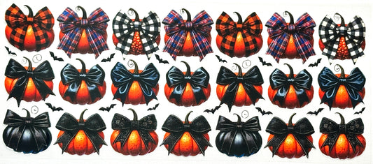 Collection of Halloween-themed decorative items including pumpkins and bows.