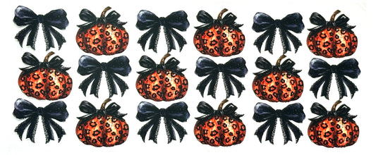 Set of Halloween-themed decorations with pumpkins, bows, and leopard print patterns.