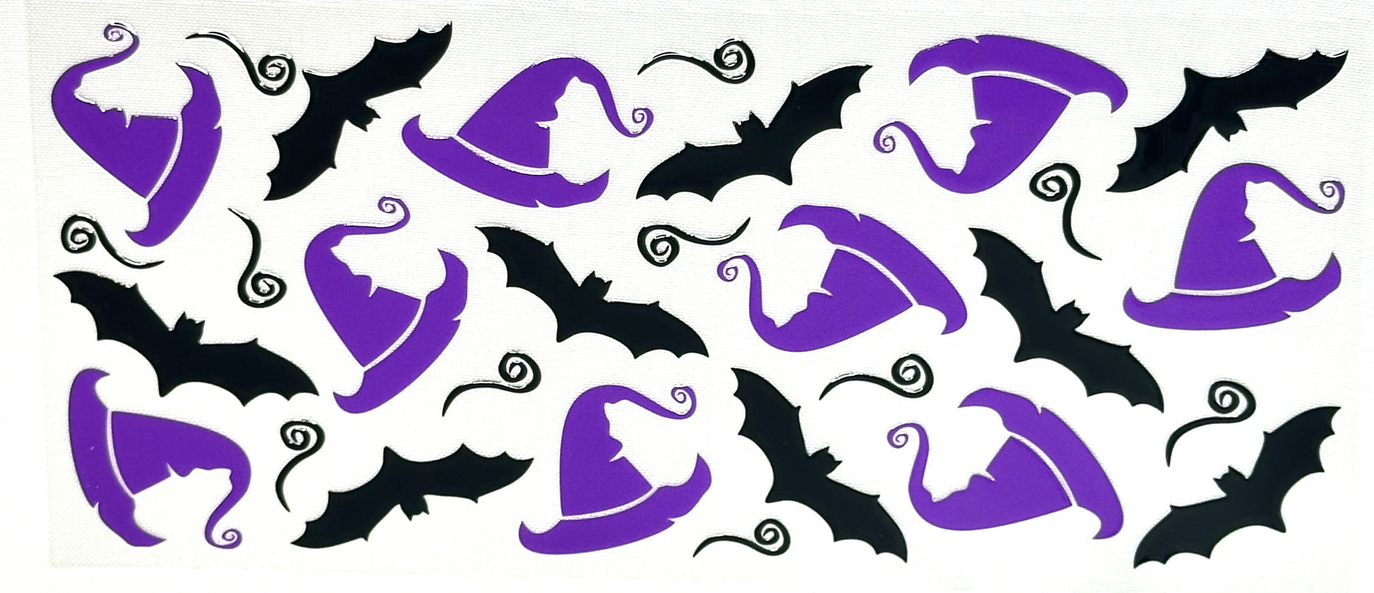 Halloween-themed design with purple witch hats and black bats 