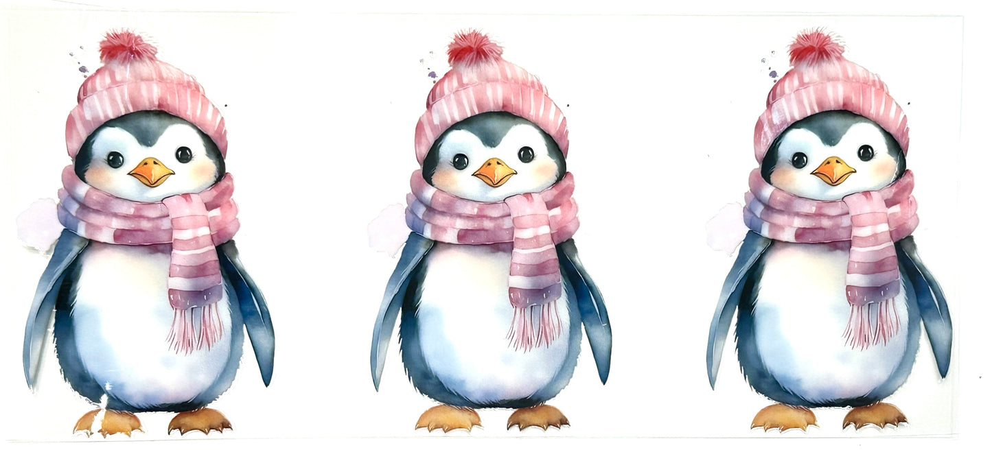 Three penguins wearing pink scarves and hats on a white background