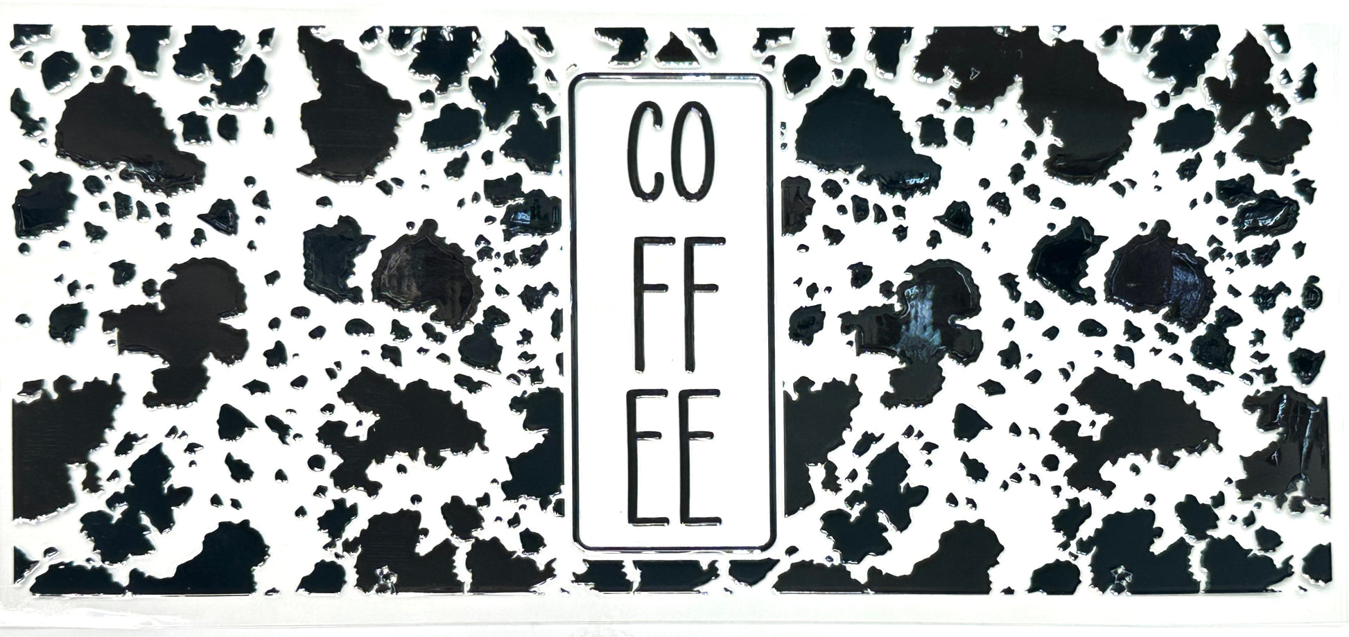 Black and white patterned mat with 'COFFEE' text