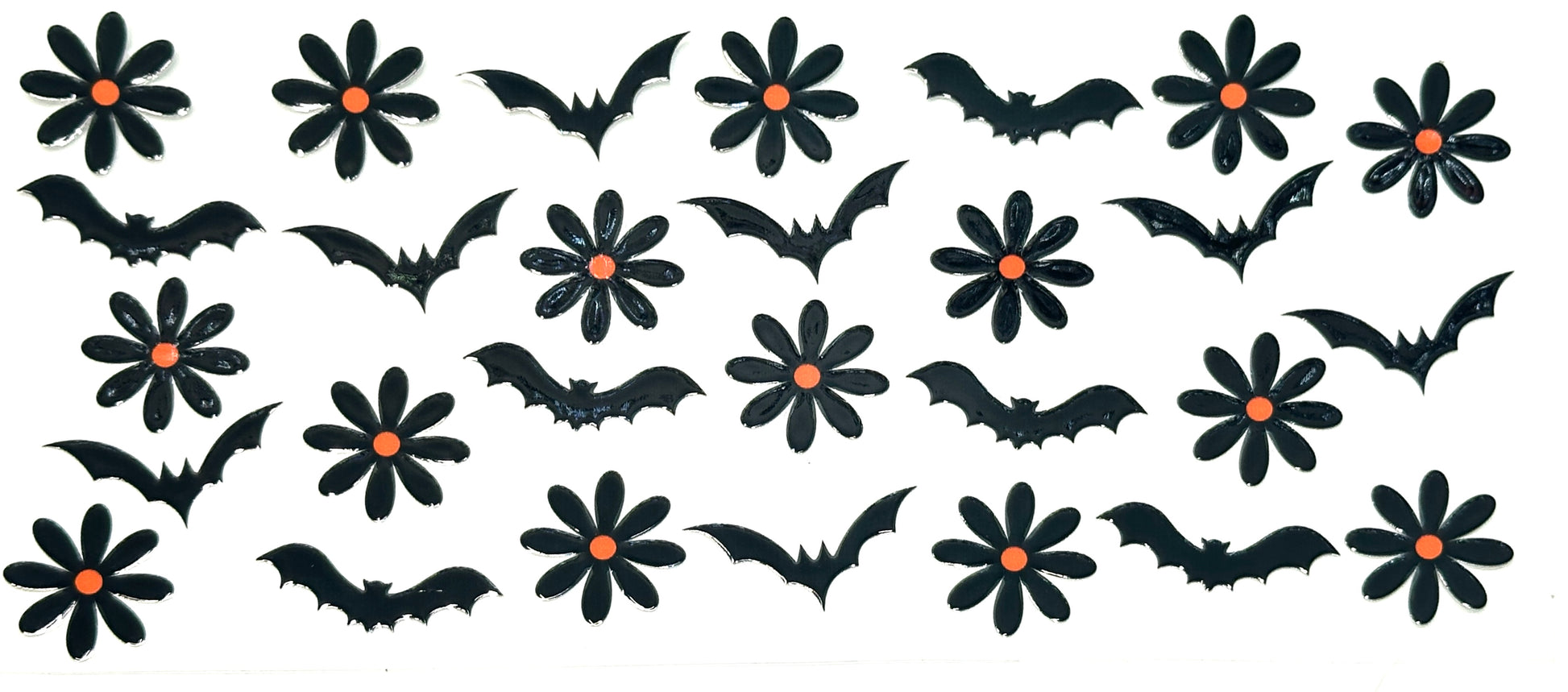 Halloween-themed decorations including black bats and flowers with orange centers on a white background.
