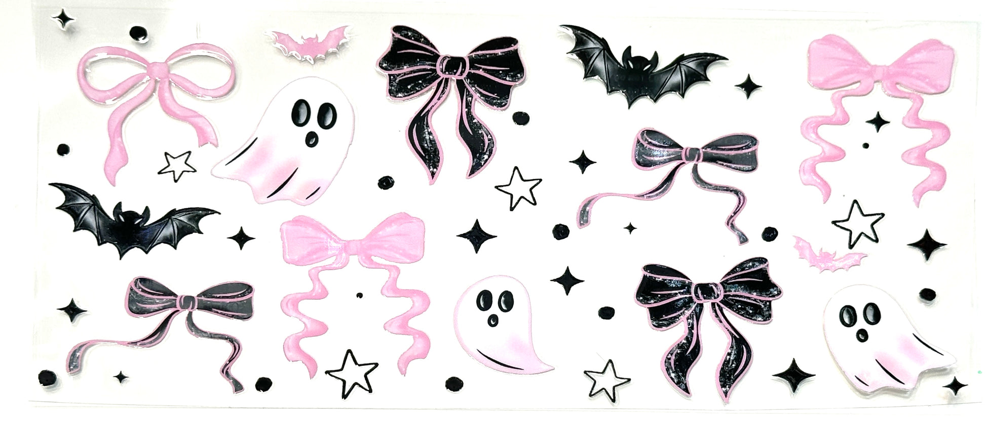 Halloween-themed decorative stickers with ghosts, bows, and bats on a white background.