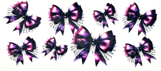 Set of purple and black decorative bows with glitter on a white background
