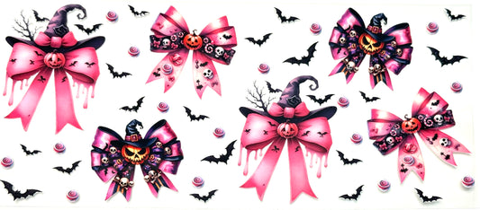 Set of Halloween-themed decorative bows with pink ribbons, pumpkins, and witch hats on a white background.