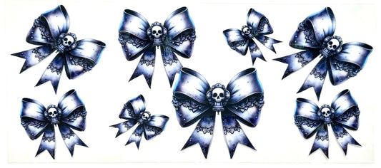 Set of decorative bows with skull designs on a white background