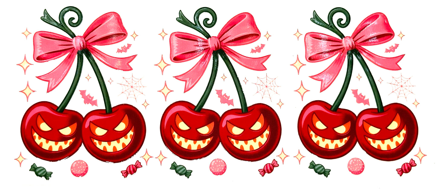 Three red cherries with glowing eyes and pink bows on a white background.