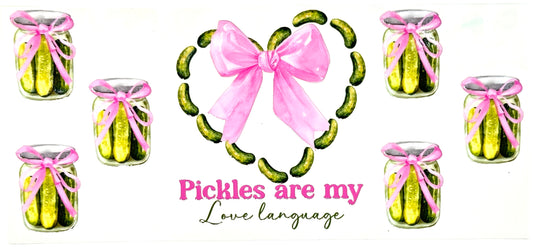 Decorative design with pickles in jars and a wreath with a pink bow, featuring the text 'Pickles are my love language'.