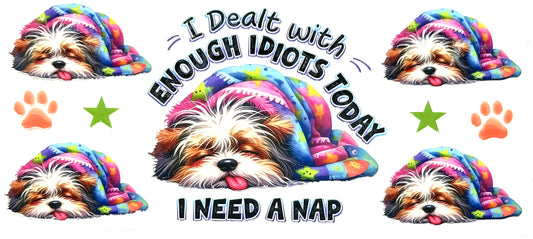 Colorful dog with text 'I Dealt with Enough Idiots Today, I Need a Nap' surrounded by paw prints and stars.