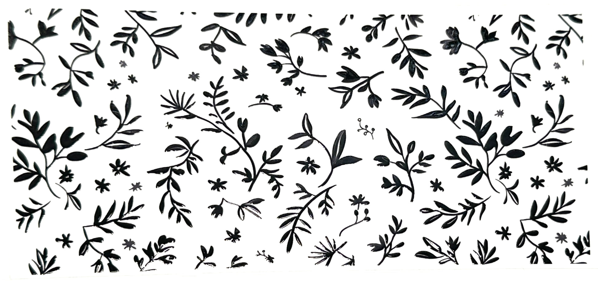 Black floral pattern on a white background