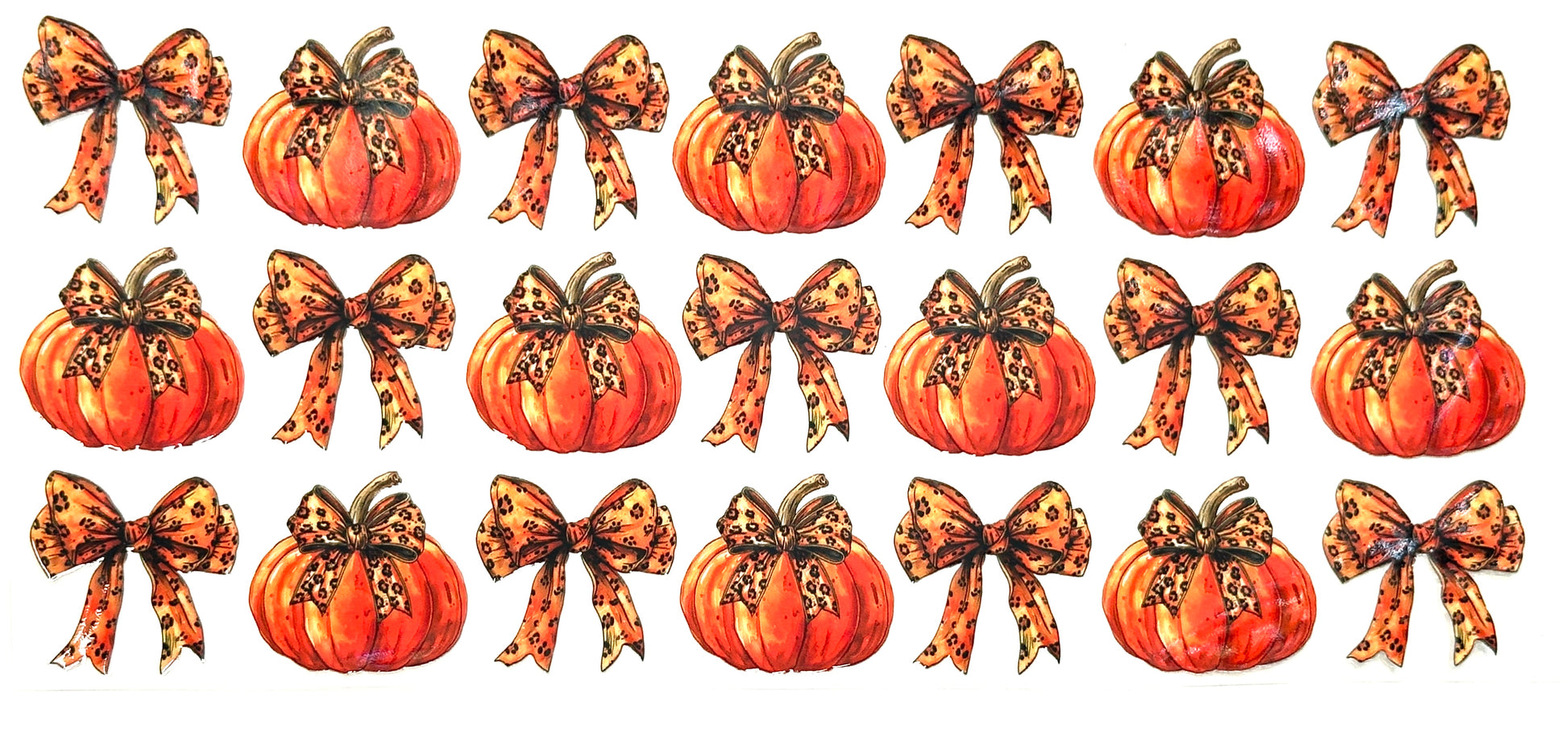 Set of pumpkins with decorative bows on a white background