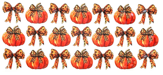 Set of pumpkins with decorative bows on a white background