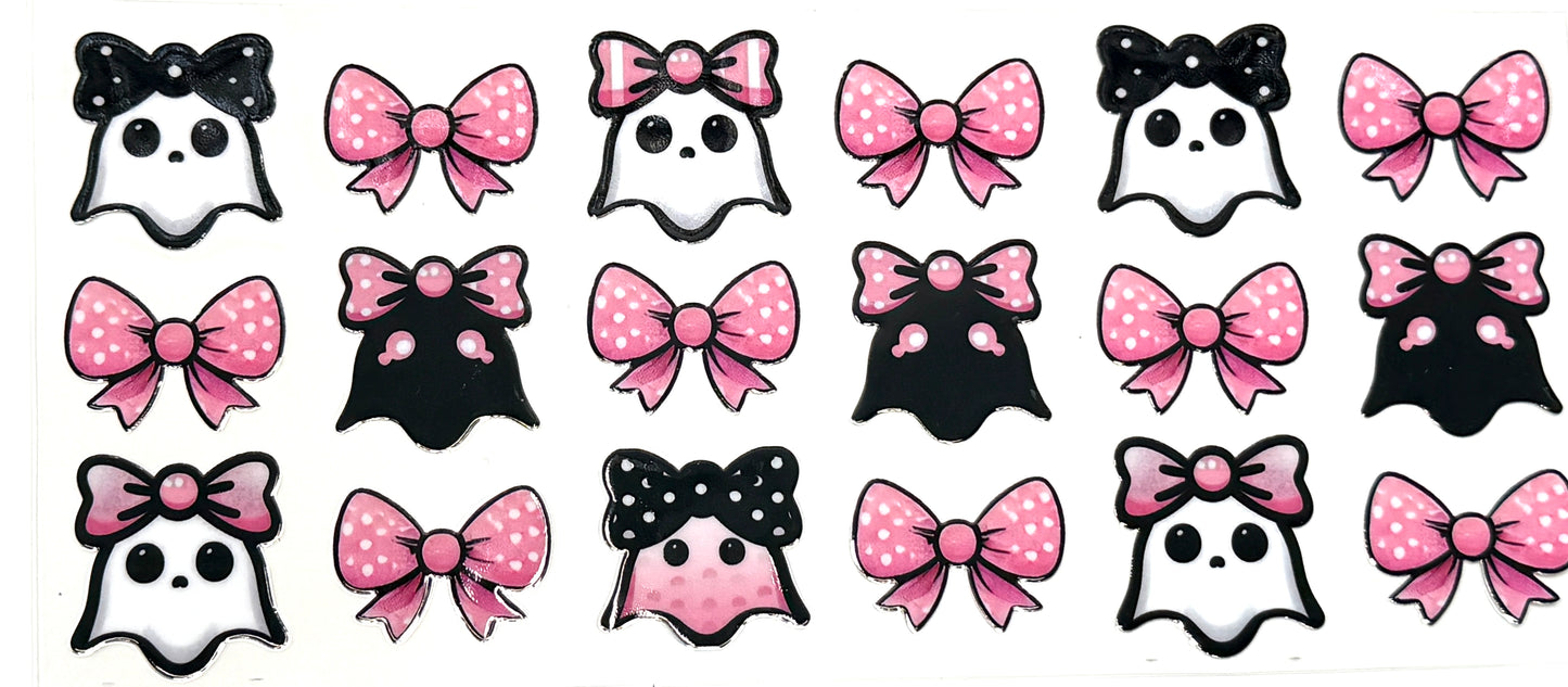 Pattern of black and white ghosts with pink and black polka dot bows on a white background
