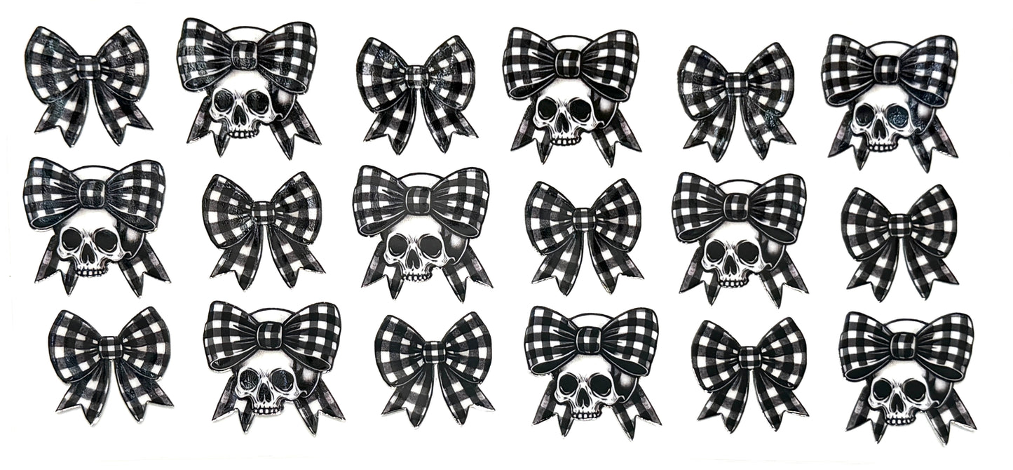 Set of black and white checkered bows with skull designs on a white background
