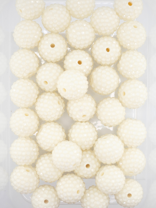 Collection of cream colored jelly rhinestone textured beads