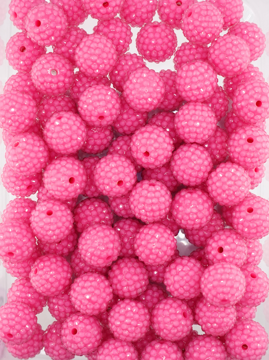 Collection of fuchsia colored jelly rhinestone textured beads