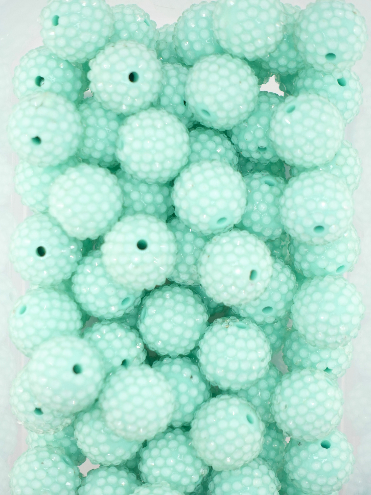 Collection of mint colored jelly rhinestone textured beads