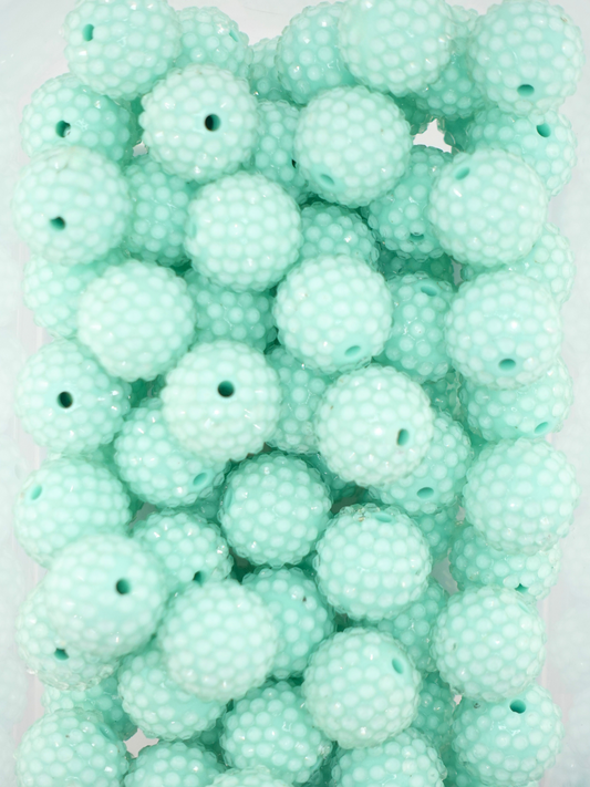 Collection of mint colored jelly rhinestone textured beads