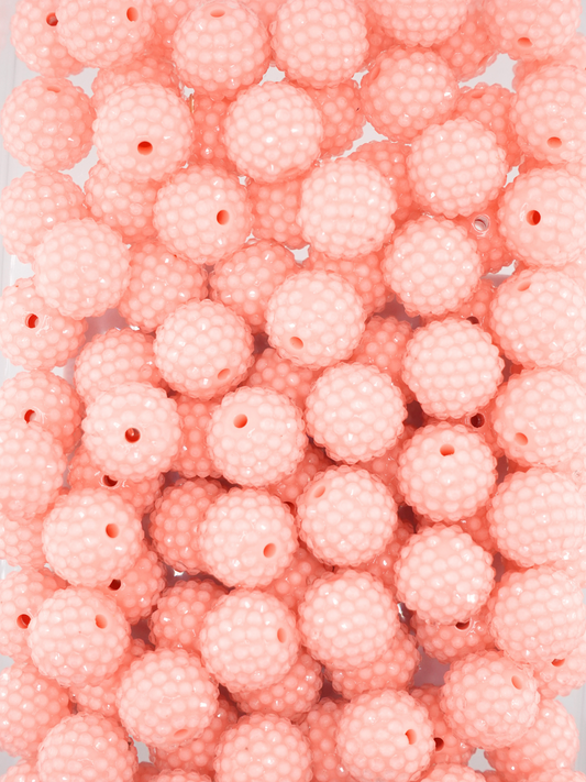 Collection of peach colored jelly rhinestone textured beads