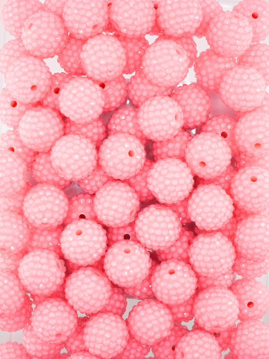 Collection of pink colored jelly rhinestone textured beads