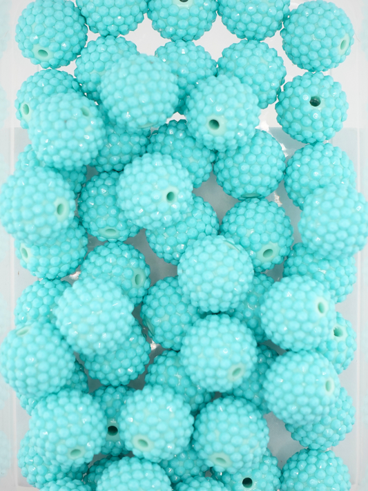 Collection of turquoise colored jelly rhinestone textured beads