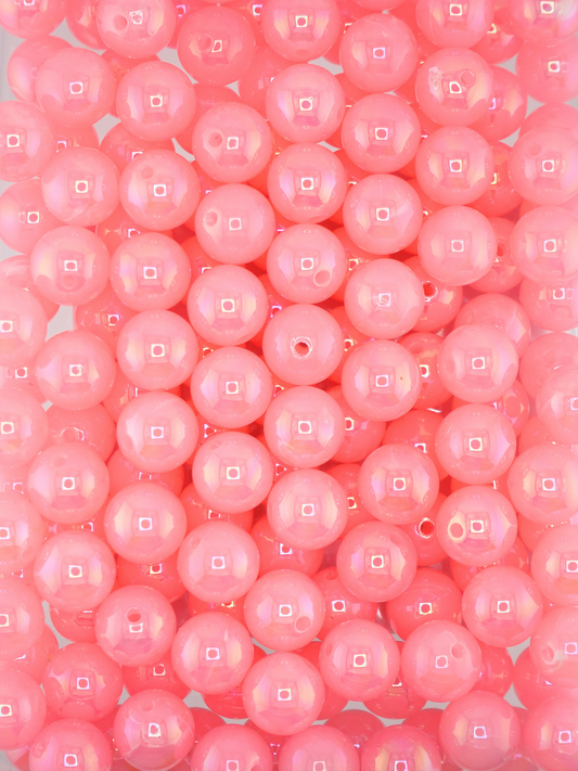 Collection of opalescent beads with a pink color