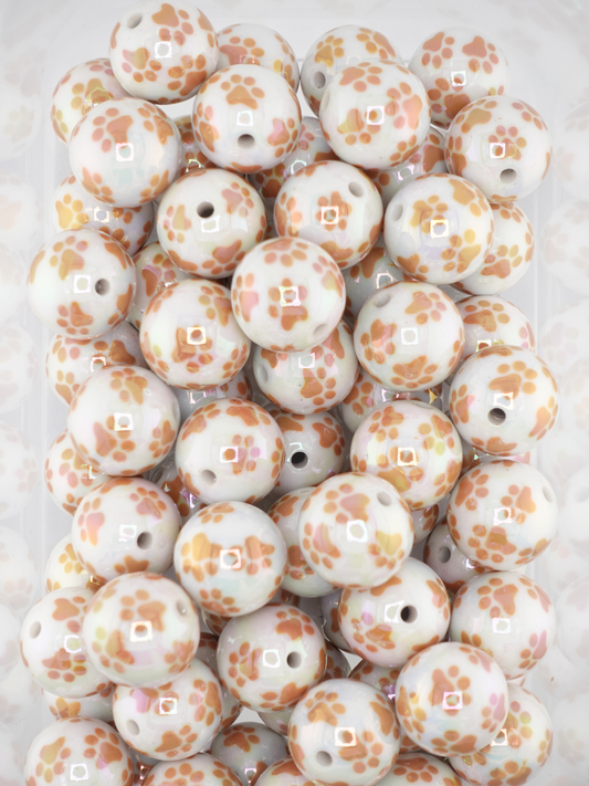 Collection of brown paw prints on white beads