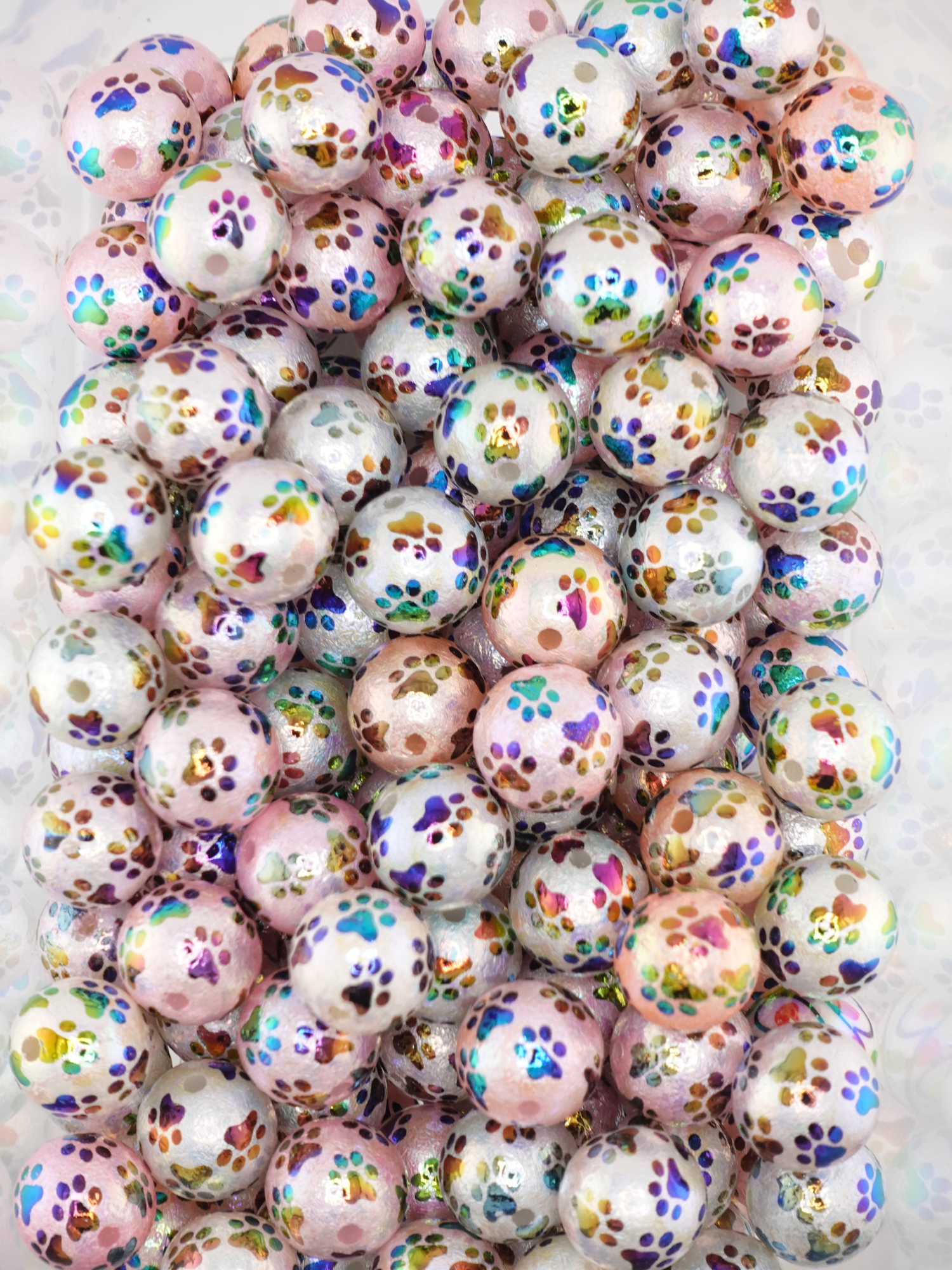 Collection of 16mm iridescent beads with a paw print design