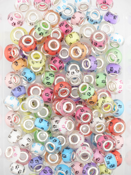 Collection of different colored spacers with a paw print design
