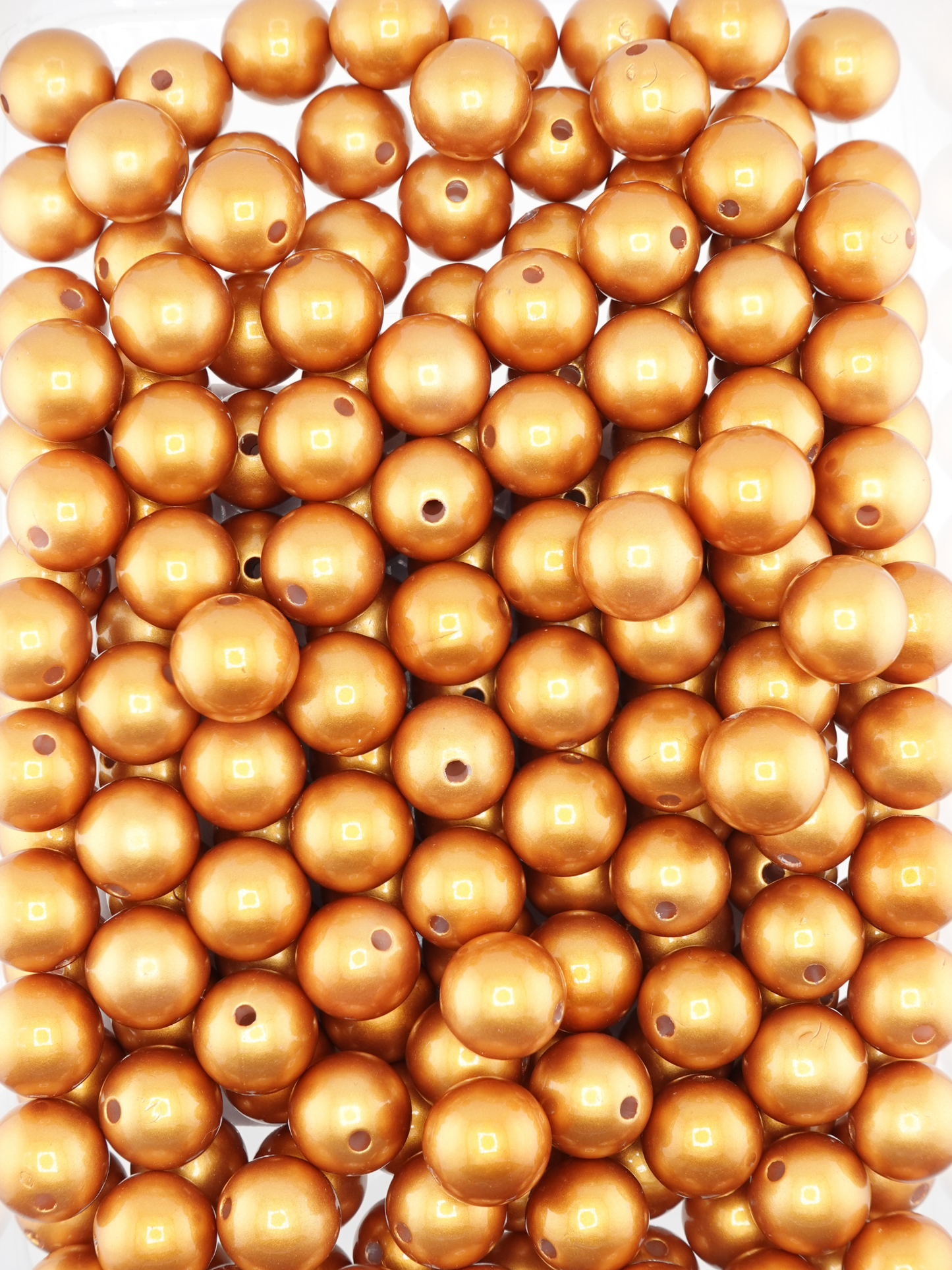 Collection of bronze colored beads with a pearl shimmer finish