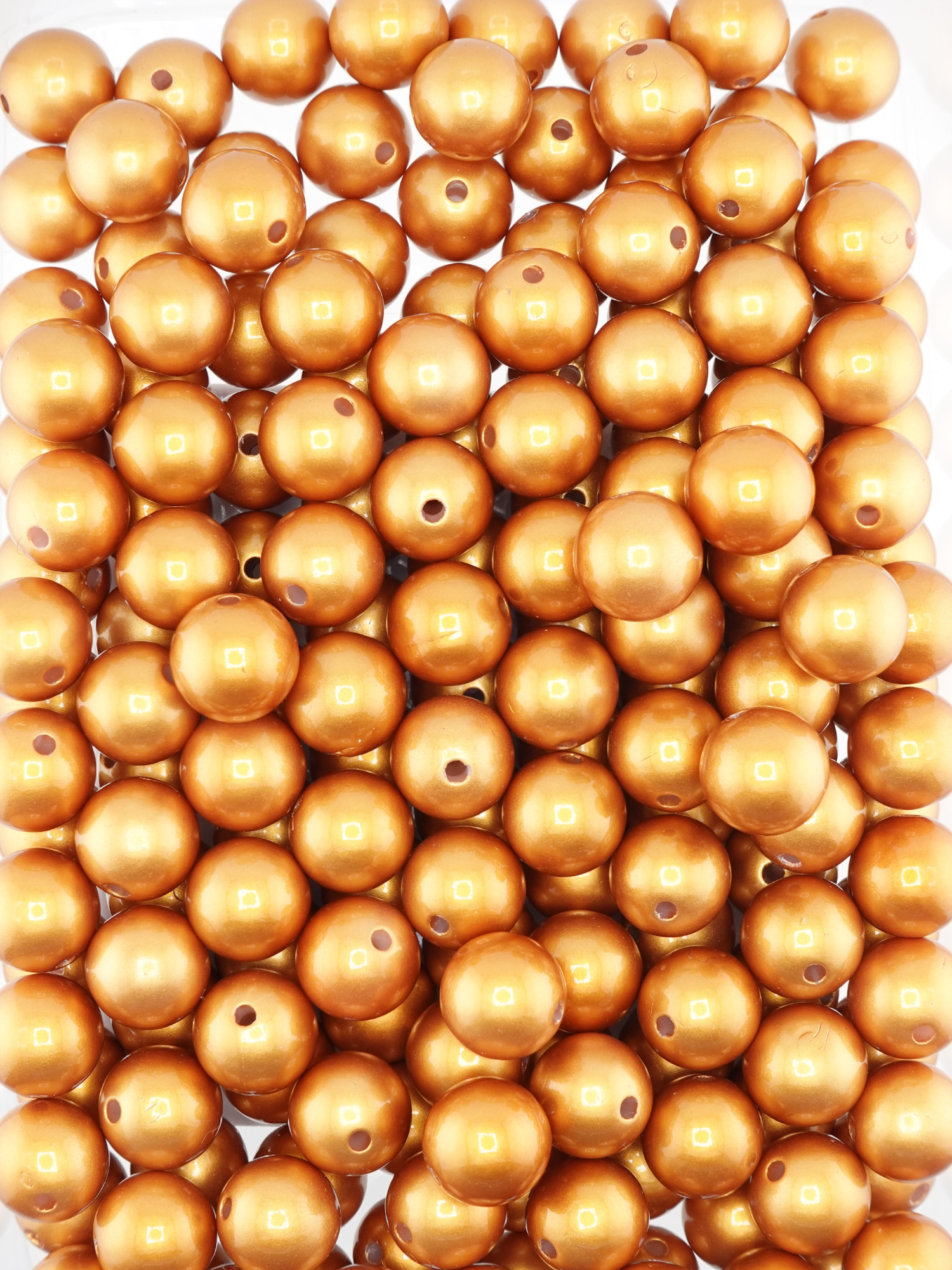 Collection of bronze colored beads with a pearl shimmer finish