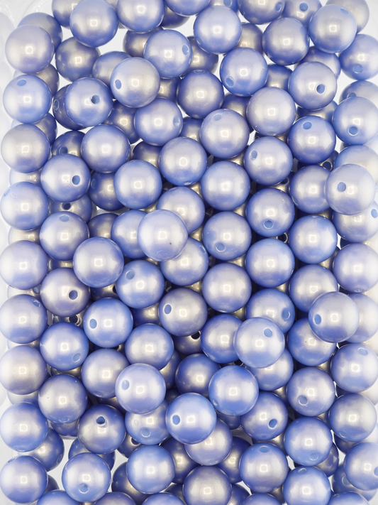 Collection of periwinkle colored beads with a pearl shimmer finish