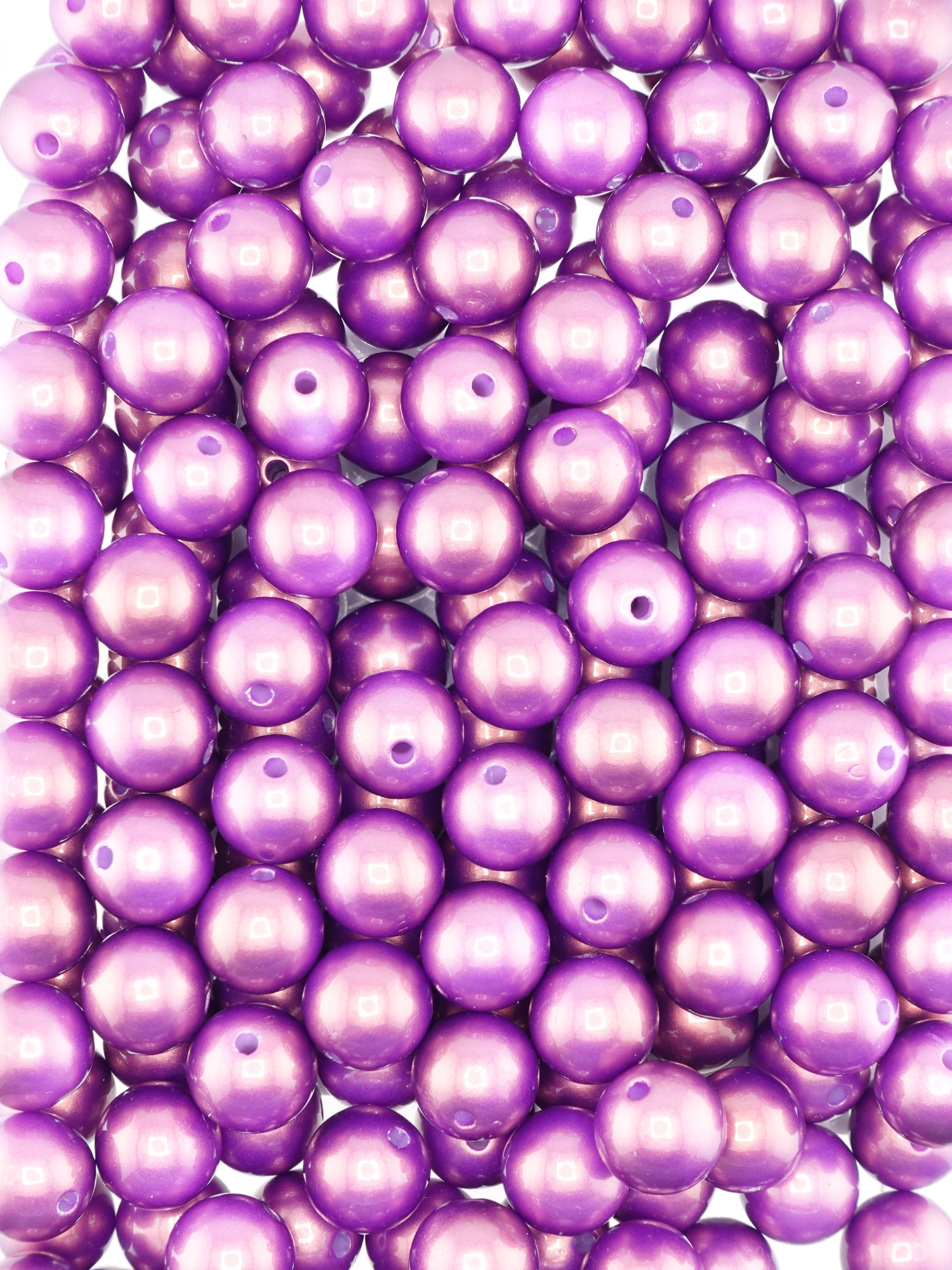 Collection of plum colored beads with a pearl shimmer finish