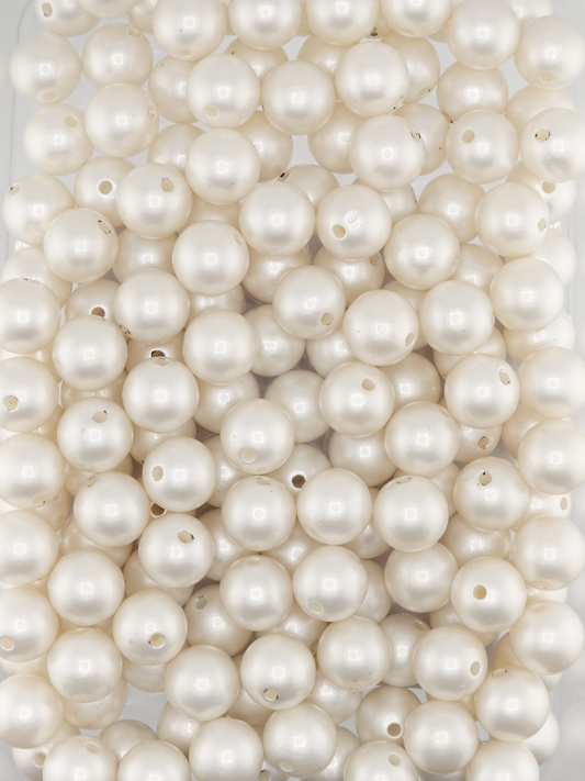 Collection of white colored beads with a pearl shimmer finish