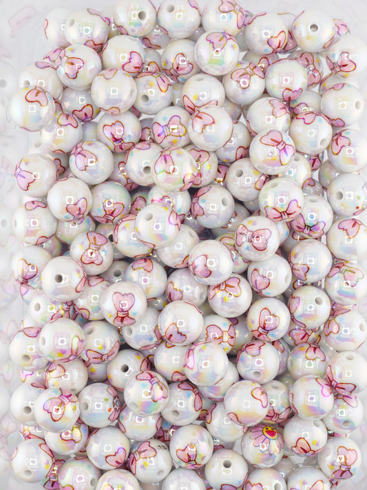 Collection of beads with a pink bow print design