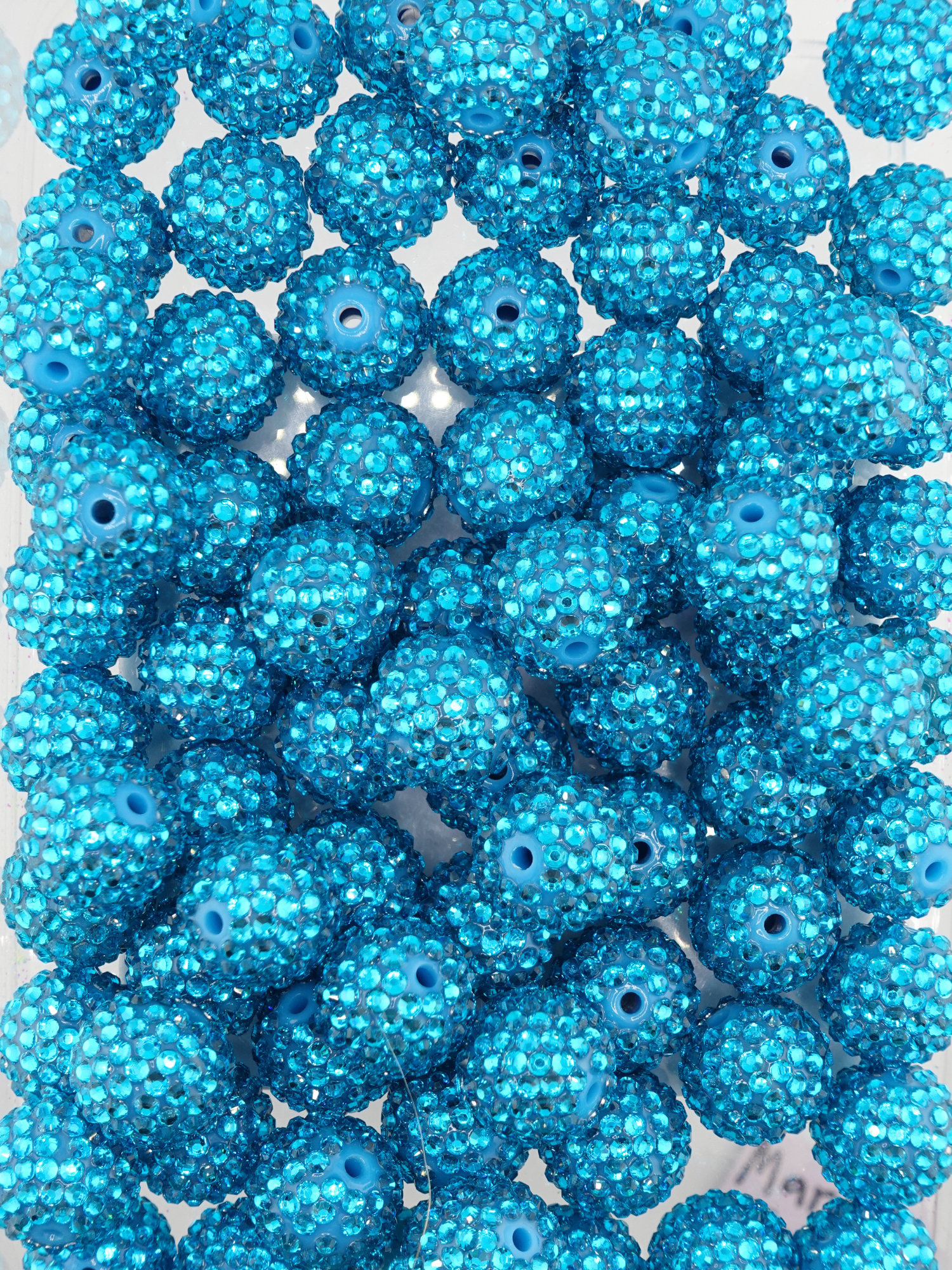 Collection of blue rhinestone textured beads
